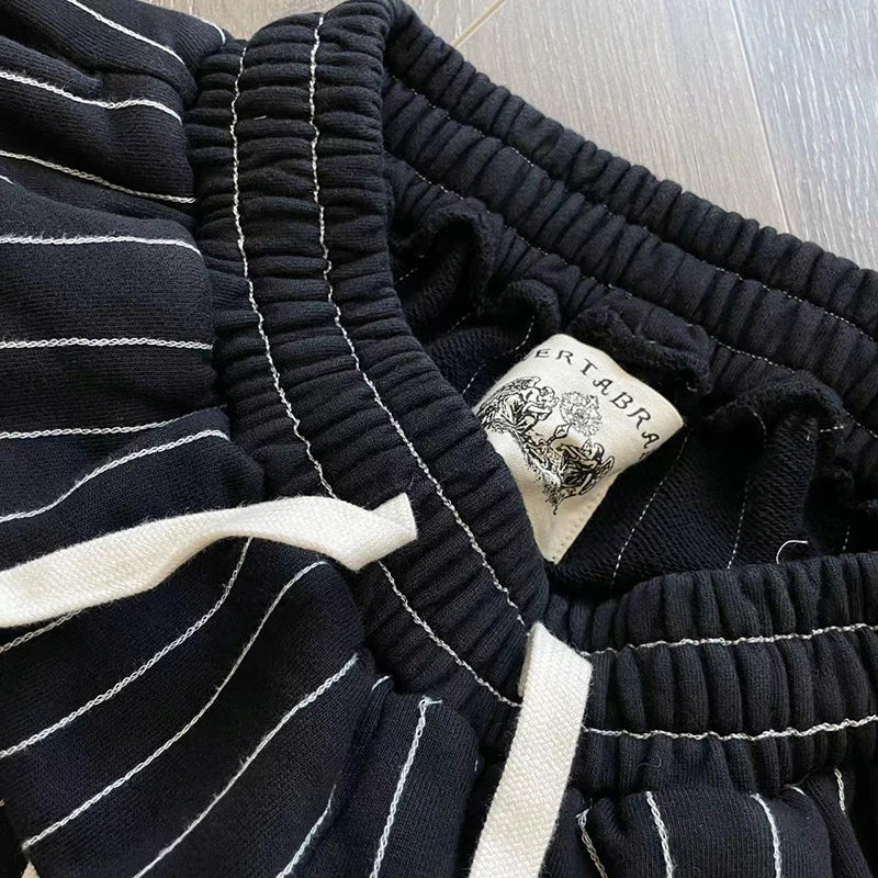 Vertabrae sweatpants with holes and classic vertical casual trousers