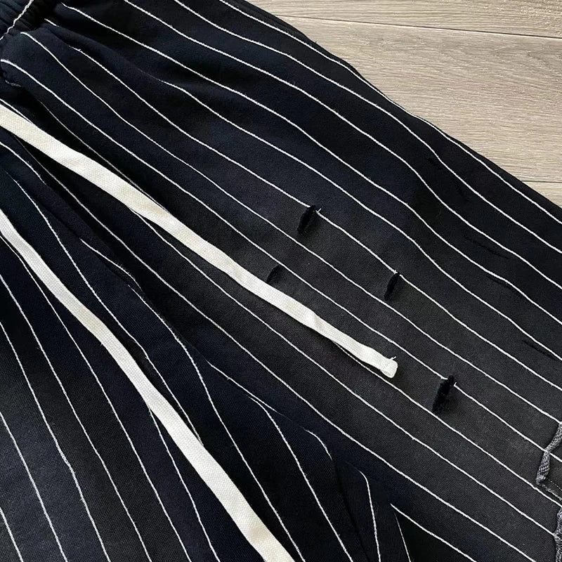 Vertabrae sweatpants with holes and classic vertical casual trousers